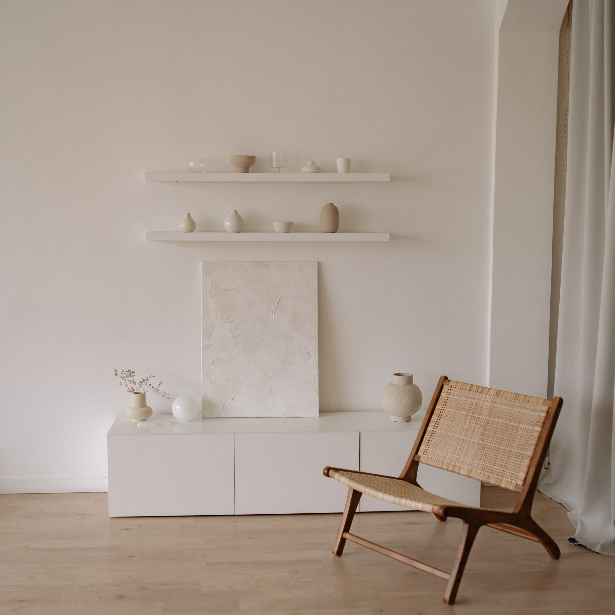 Brown Wooden Chair Beside White Wall